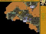 Ordos-Panzer zerstören eine gegnerische Basis (Dune Legacy).